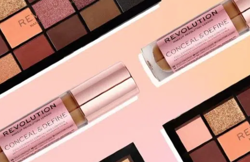 a stylised photo of lipgloss and eye shadow palettes
