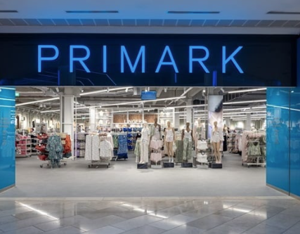 A photo of the exterior of a Primark store in a shopping mall.