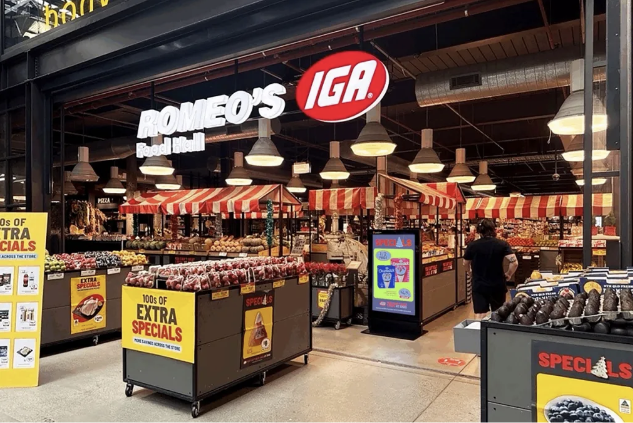 Photo of grocery store interior. Fresh produce visible.