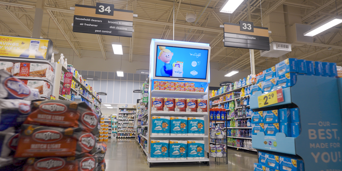 The inside of a Kroger Store with a digital end cap.