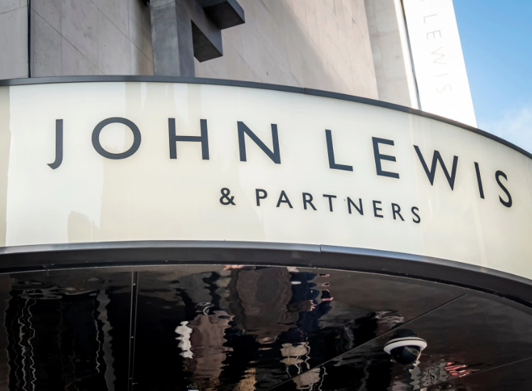 A photo of the John Lewis &Partners sign on the exterior of a store.
